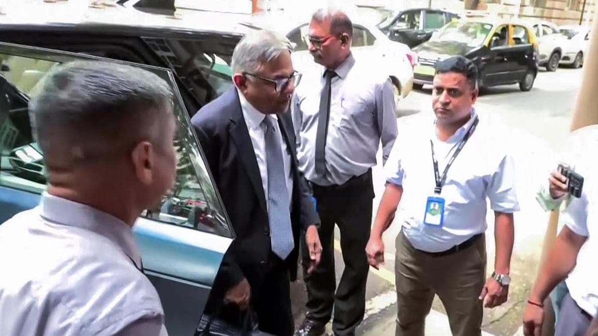 A Tata Sons executive arrives outside the venue of the annual general meeting